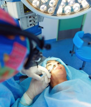 Man surgeon at work in operating room.