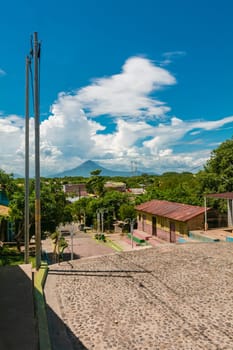 Streets of Nagarote with a view of the momotombo volcano on a beautiful day. View of the Momotombo volcano, from Nagarote