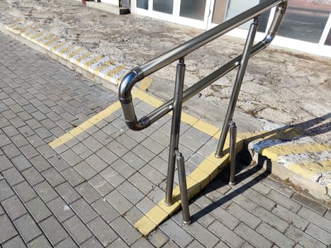 low ramp with handrails for people with disabilities close-up