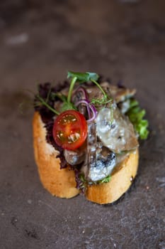 close-up bruschetta with mushrooms and chicken tomato.