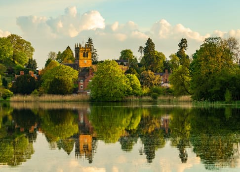 Town of Ellesmere in Shropshire with reflection view from across the Mere to the Church