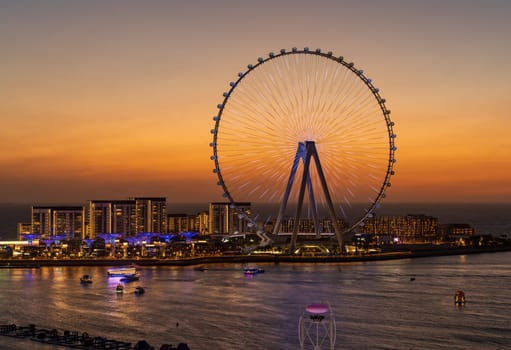 Lights on structure of Ain Dubai Observation Wheel on BlueWaters Island at sunset