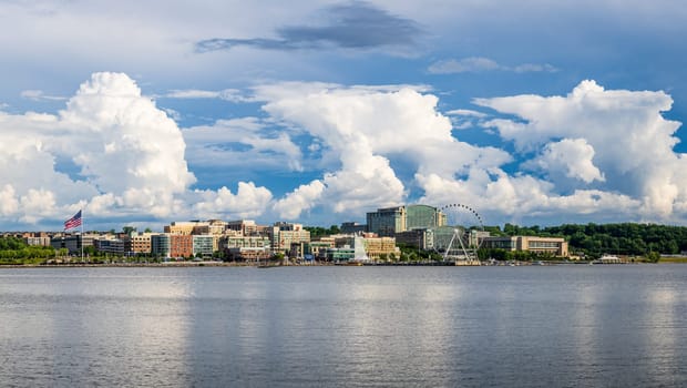 Dramatic summer clouds above panoramic skyline of National Harbor near Washington DC