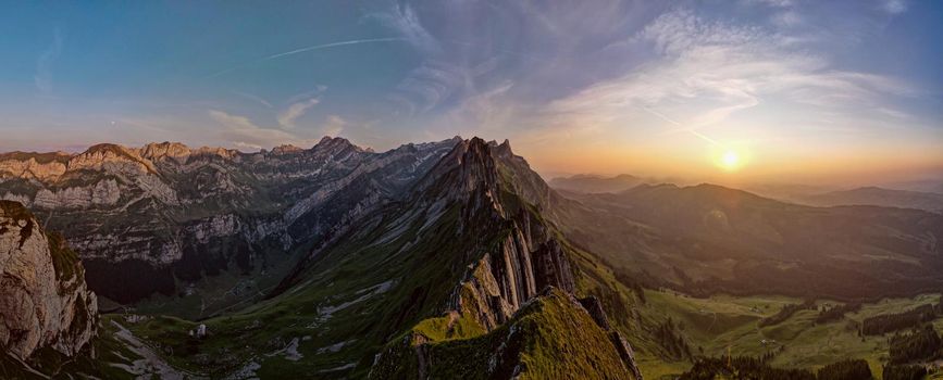 Sunset in the mountains,Schaefler Altenalptuerme mountain ridge swiss Alpstein alpine Appenzell Innerrhoden Switzerland, a steep ridge of the majestic Schaefler peak in the Alpstein mountain Switzerland. High quality photo