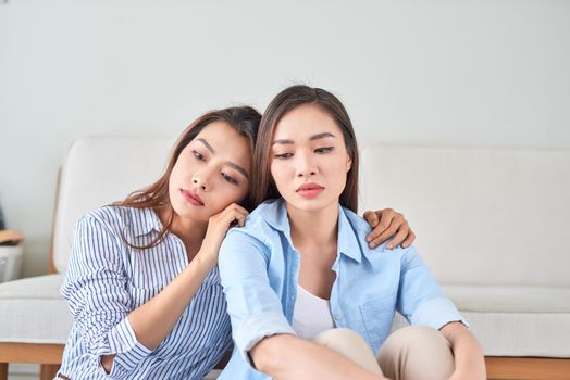 unhappy young woman share about her problem at home with her friend