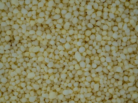 Light yellow small round granules are chemical fertilizers, calcium nitrate