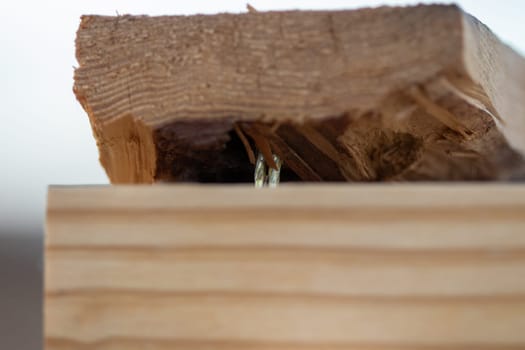 Close up of two 2x4 nailed together . High quality photo