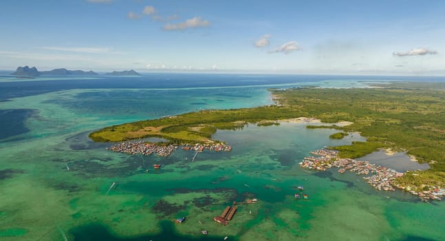 Top view of coast of the island Bum Bum with towns and villages. Tun Sakaran Marine Park. Borneo, Sabah, Malaysia.