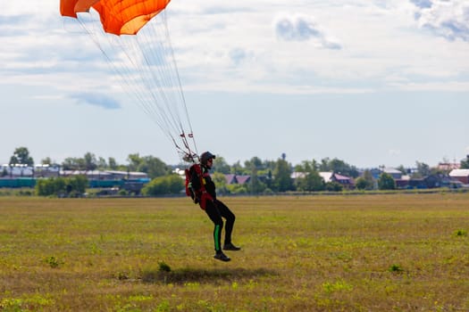 Parachute in the sky. Skydiver is flying a parachute in the blue sky. High quality photo