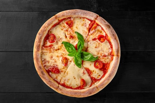 Top view of whole juicy Neapolitan pizza Margherita with pelati sauce and mozzarella cheese topped with tomatoes and fresh green basil leaves isolated on white background. Traditional Italian cuisine