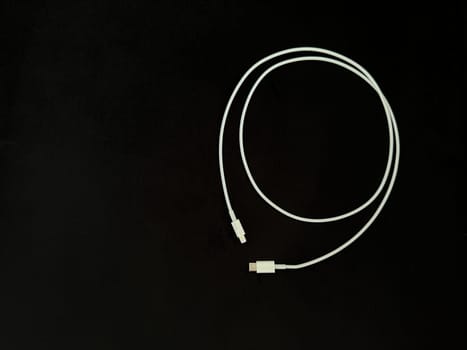 Charging wire Type C on a black background. High quality photo