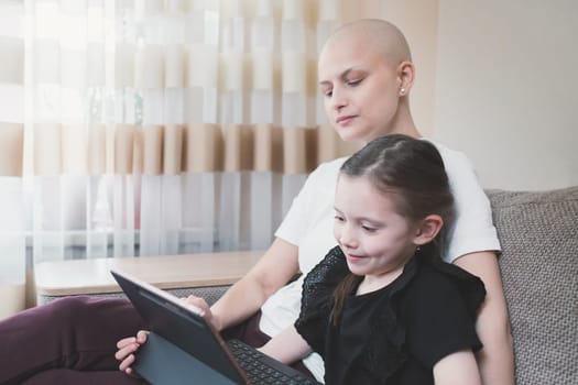Young woman with oncology spending time at home with her family. Cancer and family support concept.