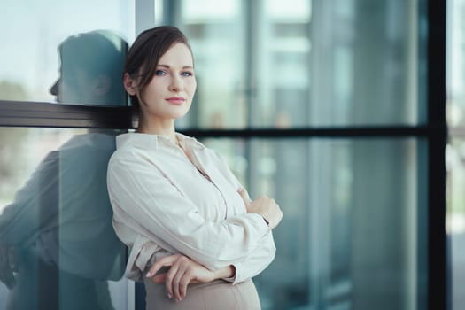 Business portrait of confident beautiful young caucasian woman. Look at camera, copy space.
