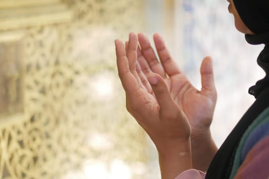 Close up of muslim women hand praying at ramadan .