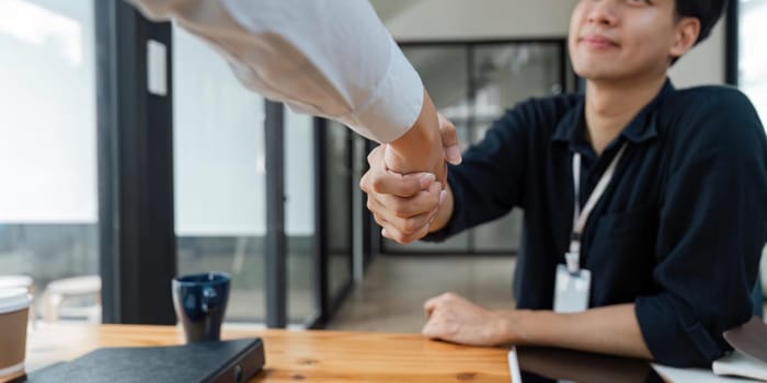 Business partnership concept. Two Businessman handshake for teamwork of business merger and acquisition at office.