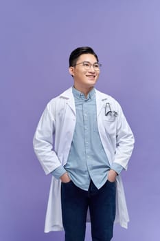 happy young asian man doctor in white uniform with stethoscope smiling isolated in studio