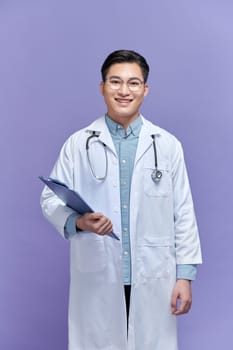A doctor with his stethoscope holding a board toward the camera