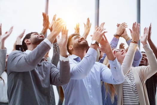 Group of young business people looking up