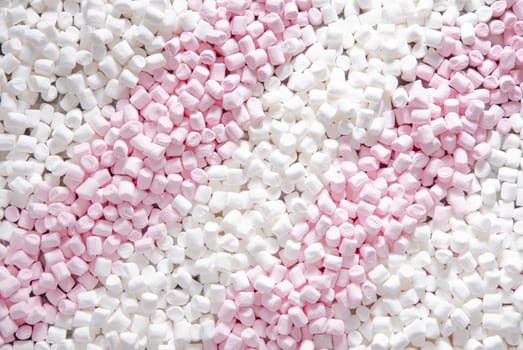 Pink and white mini puffy marshmallows background, closeup texture, Bunch of various mini puffy marshmallows, Top view, High Quality Photo