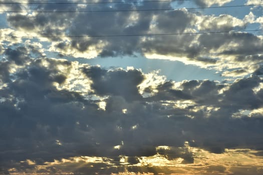 Clouds in the sunset evening sky, natural background. High quality photo