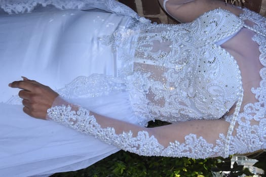 white wedding dress on the bride, no face, clothes. High quality photo