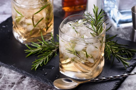 The Rosemary Vodka cocktail consists of maple syrup with a small amount of salt, rosemary, crushed ice and vodka. Vodka can be replaced with other alcohol - tequila, white rum, gin.  