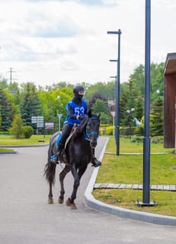 A rider rides a horse in a competition. Moscow Russia July 1, 2023. High quality photo