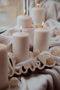 Wooden word love valentines concept Home fragnance concept autumn holidays at cozy home on the windowsill Hygge aesthetic atmosphere on knitted white sweater. Still life of micro moment candid slow living. Mental health wellbeing exercises Raining Outside