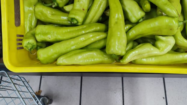 green hot peppers, vegetables food in store background. High quality photo