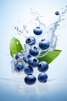 Blueberries fall into the water with splashes