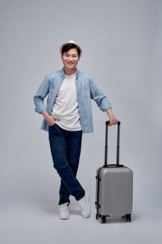 Male tourist with suitcase walking going on vacation advertising travel offer
