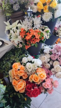 orange and white roses, artificial ornamental plants. High quality photo