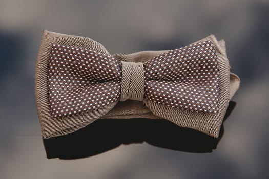 Men's bow tie on a mirror background. Close-up.