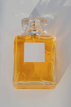 Perfume bottle with blank label. Close-up.