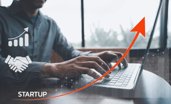 Innovative startup ideas. Businessman using laptop with graph chart of business growth. Network connections and finance investment concept. Virtual interface with icon business for marketing strategy