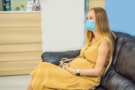 young woman in the waiting room interview sitting on sofa in corridor of dentist office or reception modern medical center while doctor's appointment. using mobile phone fills information or resumes.