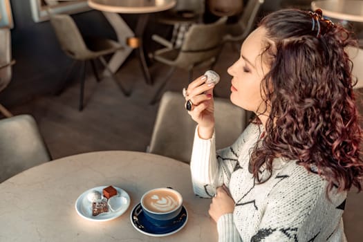 Woman cafe coffee breakfast. Portrait of an adult beautiful woman in an elegant suit in a cafe.