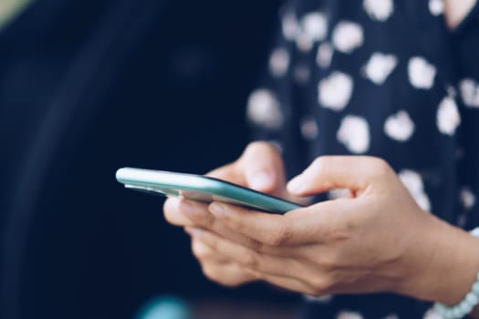 Woman hand using smartphone to do work business, social network, communication concept.