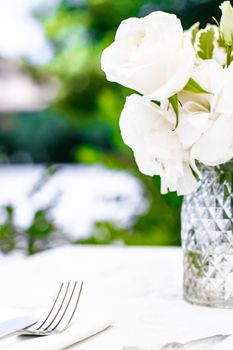 Wedding decoration, table decor and floral beauty, bouquet of white roses in luxury restaurant, beautiful flowers from summer garden.