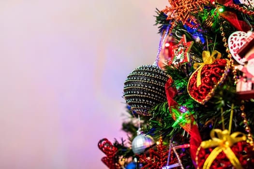 Beautiful Christmas ornaments and lights hanging in the Christmas tree