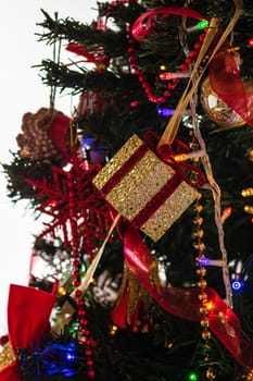 Beautiful Christmas ornaments and decorations hanging in the Christmas tree