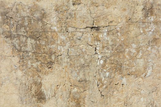 cracked white concrete wall under direct sun light full frame background and seamless texture.
