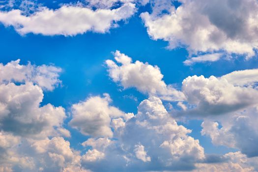 beautiful blue sky with white clouds in a bright summer day