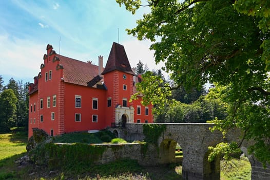 The red chateau Cervena Lhota in the the Czech Republic.
Beautiful old castle in the countryside on a summer day. Colorful nature background.