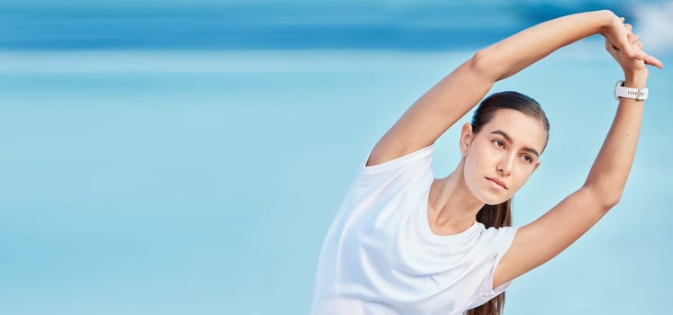 Woman, beach and stretching body on mockup space in fitness, motivation or outdoor workout. Female person or runner in warm up on ocean coast, banner or sports for healthy wellness and exercise.