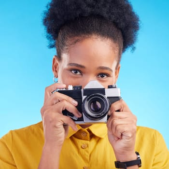 Photographer, portrait and camera, black woman isolated on blue background, creative artist job talent. Art, face of happy girl in photography hobby or career in studio on travel holiday photoshoot