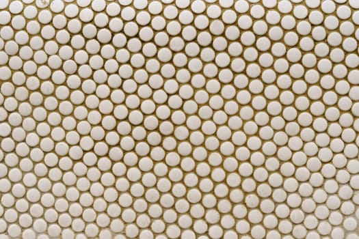 Texture of round white tiles, mosaics. Textures and backgrounds.