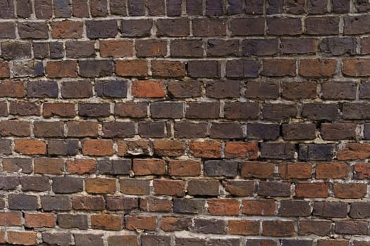 Old brick wall made of red bricks. Texture of a brick wall.