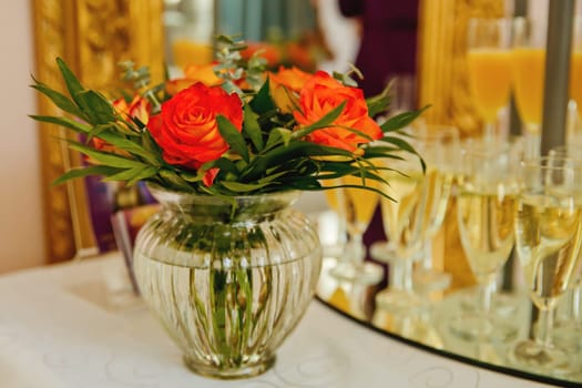 Composition of fresh flowers on a festive wedding table. Elegance wedding decor. Selective focus.