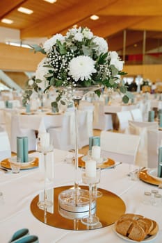 Wedding table with favors and flowers. Elegance wedding decor.